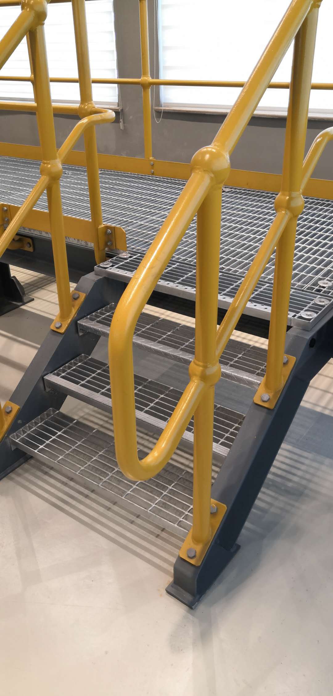 installation of steel grating floor and stair tread